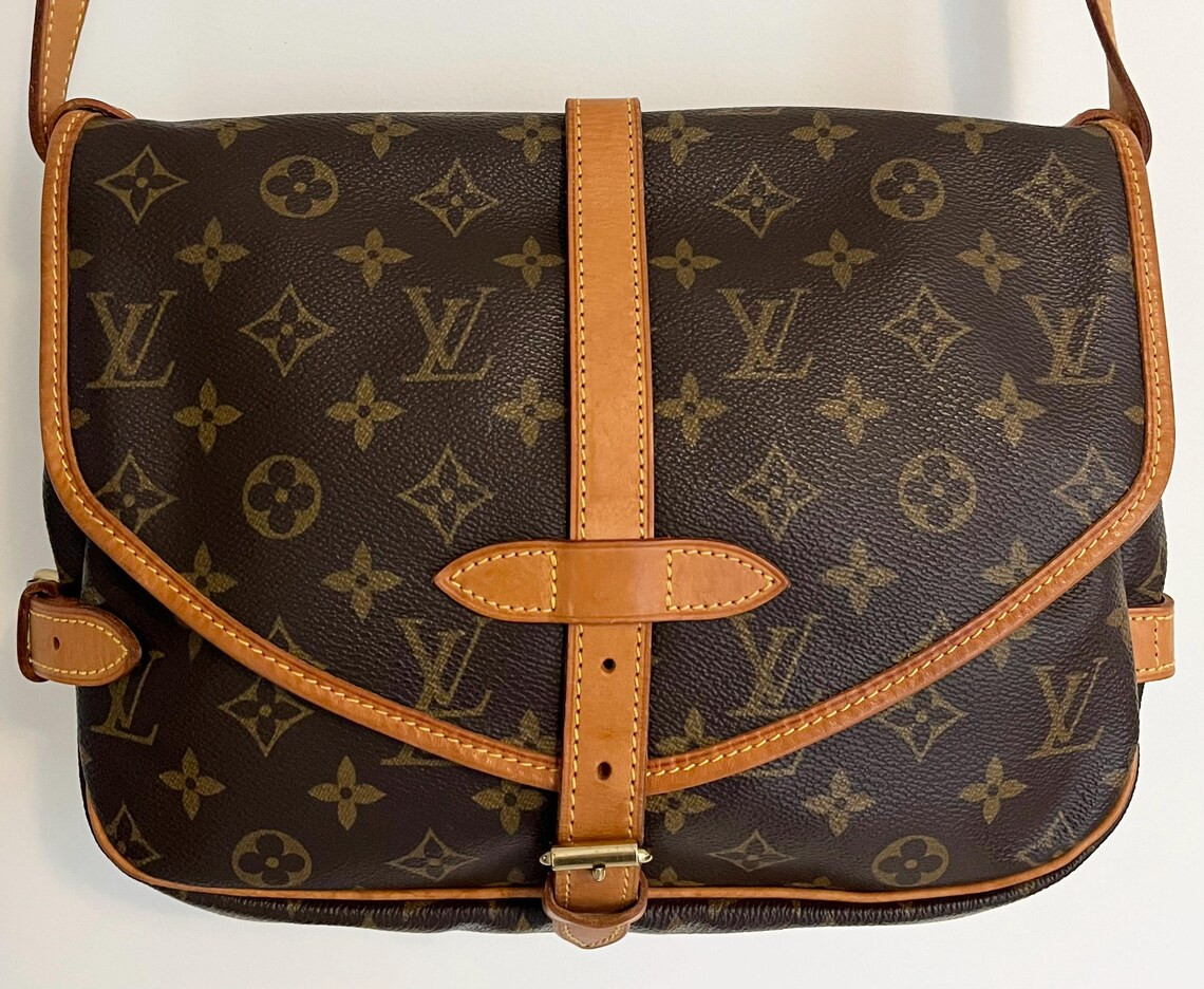 Louis Vuitton Saumur 30 bag monogram canvas and natural leather shoulder strap